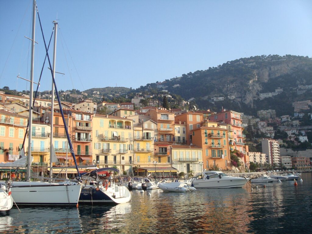 Yachts and sailboats in front of homes on the Amalfi Coast