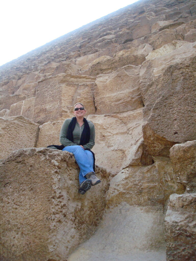 Laura sitting on the step of The Great Pyramid