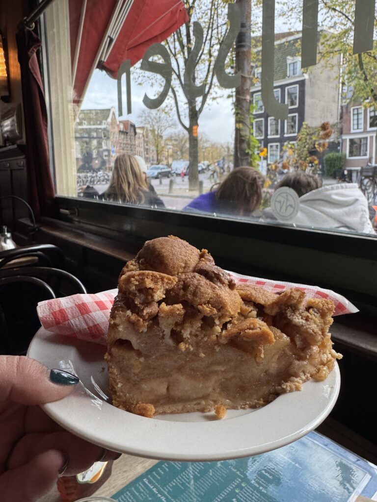 Picture of Dutch apple pie in front of a cafe window